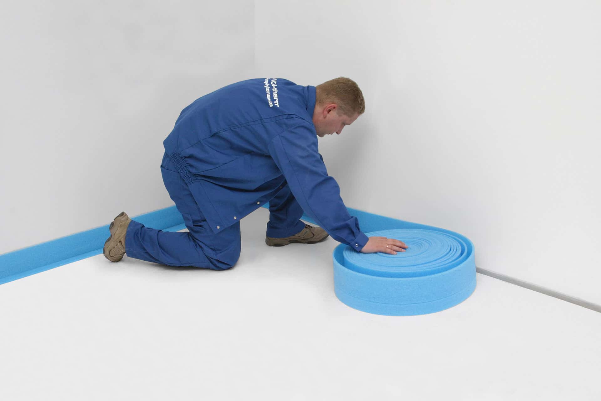 KAN-therm - Rail system - Installation step 1 - Spreading baffle tape along building partitions